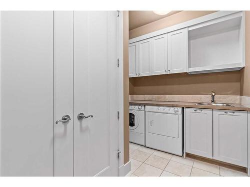 224 Clearwater Way, Rural Rocky View County, AB - Indoor Photo Showing Laundry Room