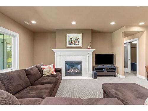 224 Clearwater Way, Rural Rocky View County, AB - Indoor Photo Showing Living Room With Fireplace