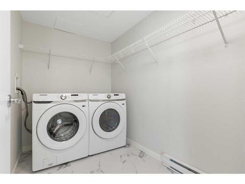 1207-220 Seton Grove Se, Calgary, AB - Indoor Photo Showing Laundry Room
