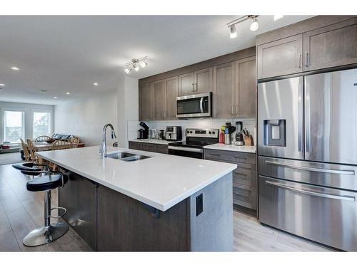 20559 Seton Way Se, Calgary, AB - Indoor Photo Showing Kitchen With Stainless Steel Kitchen With Double Sink With Upgraded Kitchen