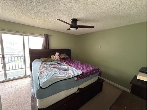 17 Mckernan Road Se, Calgary, AB - Indoor Photo Showing Bedroom