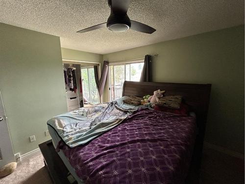 17 Mckernan Road Se, Calgary, AB - Indoor Photo Showing Bedroom