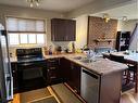 17 Mckernan Road Se, Calgary, AB  - Indoor Photo Showing Kitchen With Double Sink 