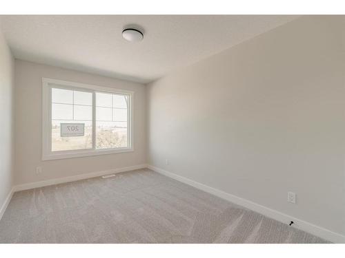 207 Silver Spruce Grove Sw, Calgary, AB - Indoor Photo Showing Other Room