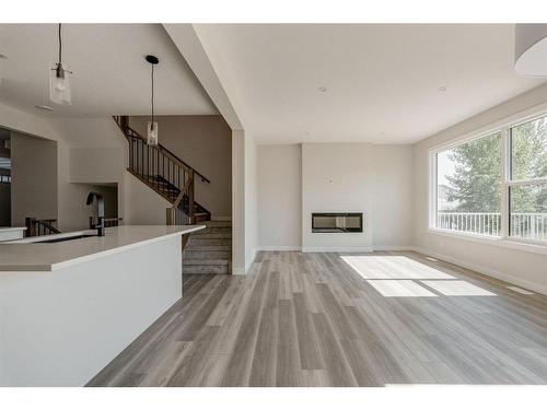 207 Silver Spruce Grove Sw, Calgary, AB - Indoor Photo Showing Other Room With Fireplace