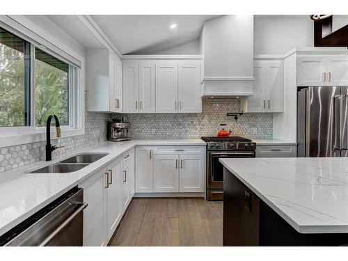 14 Butte Place Nw, Calgary, AB - Indoor Photo Showing Kitchen With Stainless Steel Kitchen With Double Sink With Upgraded Kitchen