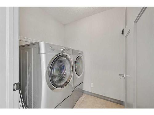 61 Chaparral Valley Square Se, Calgary, AB - Indoor Photo Showing Laundry Room