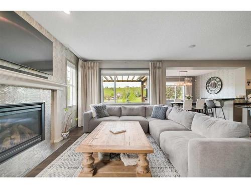 61 Chaparral Valley Square Se, Calgary, AB - Indoor Photo Showing Living Room With Fireplace