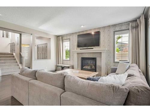 61 Chaparral Valley Square Se, Calgary, AB - Indoor Photo Showing Living Room With Fireplace