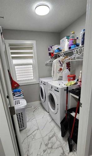 240 Creekstone Row Sw, Calgary, AB - Indoor Photo Showing Laundry Room
