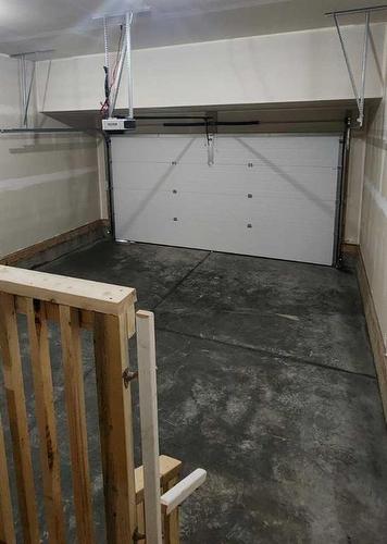 240 Creekstone Row Sw, Calgary, AB - Indoor Photo Showing Garage