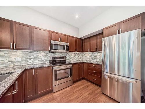 235-4303 1 Street Ne, Calgary, AB - Indoor Photo Showing Kitchen With Upgraded Kitchen