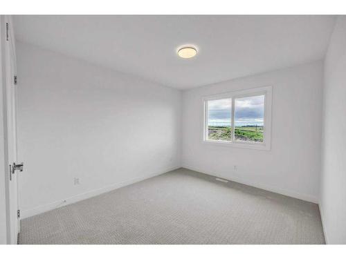 191 Dawson Wharf Rise, Chestermere, AB - Indoor Photo Showing Other Room