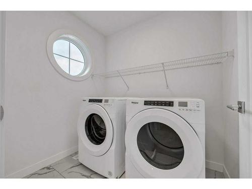 191 Dawson Wharf Rise, Chestermere, AB - Indoor Photo Showing Laundry Room