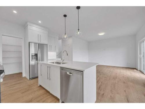 191 Dawson Wharf Rise, Chestermere, AB - Indoor Photo Showing Kitchen With Stainless Steel Kitchen With Double Sink With Upgraded Kitchen