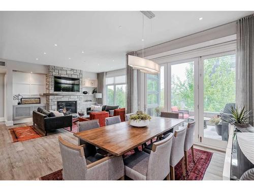 204-3030 17 Street Sw, Calgary, AB - Indoor Photo Showing Other Room With Fireplace