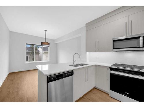 7379 202 Avenue Se, Calgary, AB - Indoor Photo Showing Kitchen With Double Sink