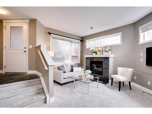 22-2040 35 Avenue Sw, Calgary, AB - Indoor Photo Showing Living Room With Fireplace
