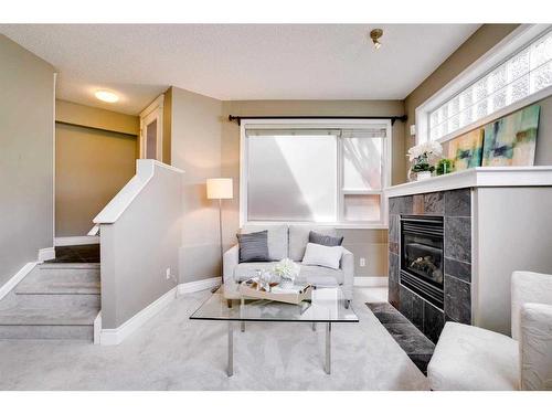 22-2040 35 Avenue Sw, Calgary, AB - Indoor Photo Showing Living Room With Fireplace
