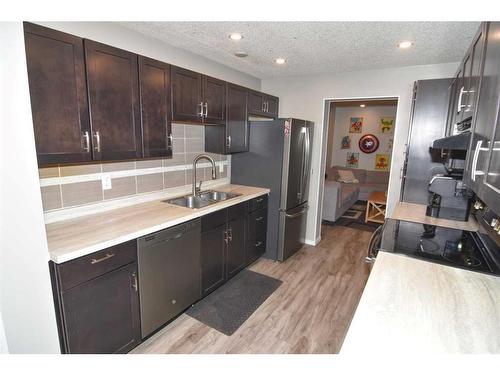 79 Abingdon Way Ne, Calgary, AB - Indoor Photo Showing Kitchen With Double Sink