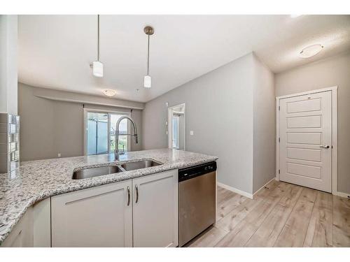 325-20 Seton Park Se, Calgary, AB - Indoor Photo Showing Kitchen With Double Sink