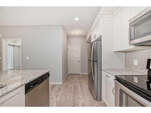 325-20 Seton Park Se, Calgary, AB - Indoor Photo Showing Kitchen With Stainless Steel Kitchen