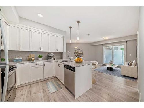 325-20 Seton Park Se, Calgary, AB - Indoor Photo Showing Kitchen With Stainless Steel Kitchen With Upgraded Kitchen