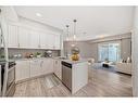 325-20 Seton Park Se, Calgary, AB  - Indoor Photo Showing Kitchen With Stainless Steel Kitchen With Upgraded Kitchen 