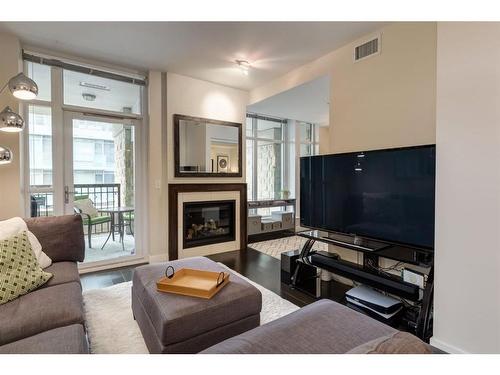 617-222 Riverfront Avenue Sw, Calgary, AB - Indoor Photo Showing Living Room With Fireplace