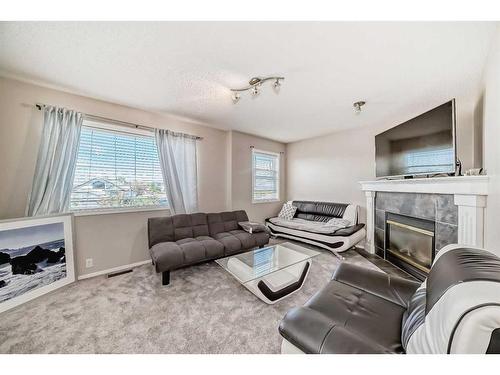 50 Covewood Circle Ne, Calgary, AB - Indoor Photo Showing Living Room With Fireplace