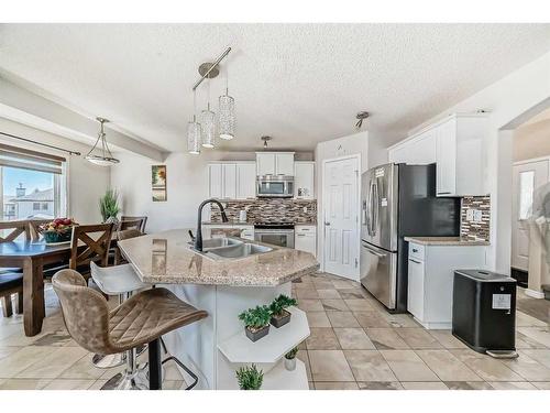 50 Covewood Circle Ne, Calgary, AB - Indoor Photo Showing Kitchen With Stainless Steel Kitchen With Double Sink With Upgraded Kitchen