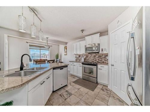 50 Covewood Circle Ne, Calgary, AB - Indoor Photo Showing Kitchen With Stainless Steel Kitchen With Double Sink With Upgraded Kitchen