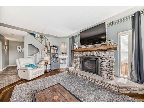 272 Springmere  Way, Chestermere, AB - Indoor Photo Showing Living Room With Fireplace