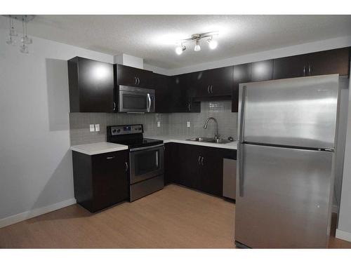 106-250 Sage Valley Road Nw, Calgary, AB - Indoor Photo Showing Kitchen With Stainless Steel Kitchen