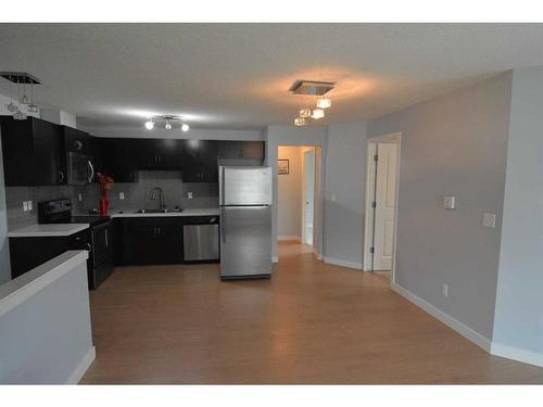 106-250 Sage Valley Road Nw, Calgary, AB - Indoor Photo Showing Kitchen