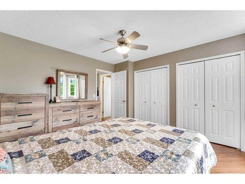 285 Hidden Spring Green Nw, Calgary, AB - Indoor Photo Showing Bedroom