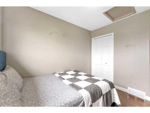 285 Hidden Spring Green Nw, Calgary, AB - Indoor Photo Showing Bedroom