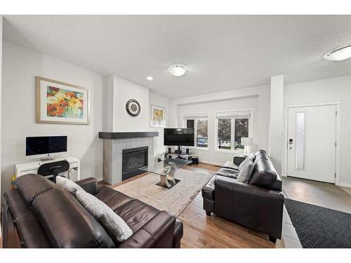 44 Walgrove Green Se, Calgary, AB - Indoor Photo Showing Living Room With Fireplace