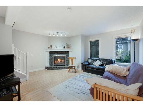 5-1339 14 Avenue Sw, Calgary, AB - Indoor Photo Showing Living Room With Fireplace