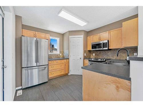 24 Panamount Gate Nw, Calgary, AB - Indoor Photo Showing Kitchen With Double Sink