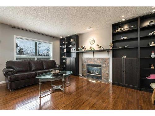 129 Millrise Square Sw, Calgary, AB - Indoor Photo Showing Living Room With Fireplace