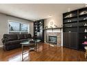 129 Millrise Square Sw, Calgary, AB  - Indoor Photo Showing Living Room With Fireplace 