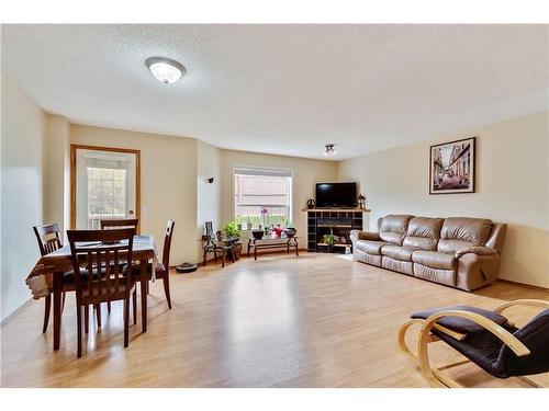 172 Mt Aberdeen Manor Se, Calgary, AB - Indoor Photo Showing Living Room With Fireplace