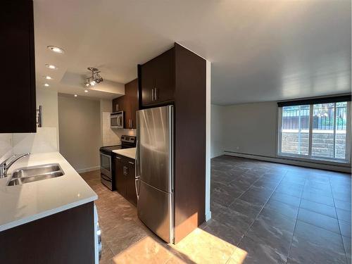 2-1230 Cameron Avenue Sw, Calgary, AB - Indoor Photo Showing Kitchen With Stainless Steel Kitchen With Double Sink