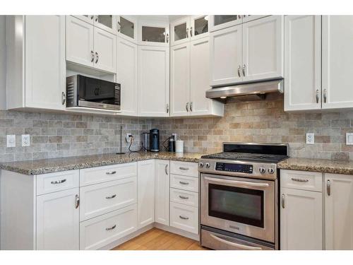 210 Montenaro Place, Rural Rocky View County, AB - Indoor Photo Showing Kitchen