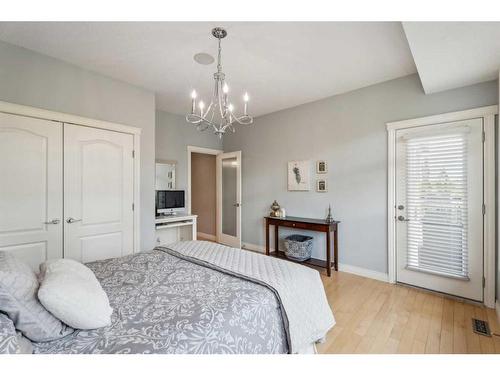 210 Montenaro Place, Rural Rocky View County, AB - Indoor Photo Showing Bedroom