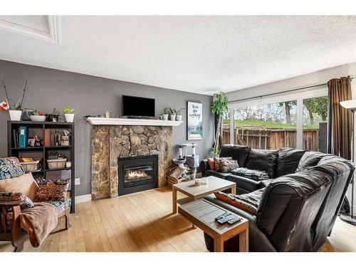 152-66 Glamis Green Sw, Calgary, AB - Indoor Photo Showing Living Room With Fireplace