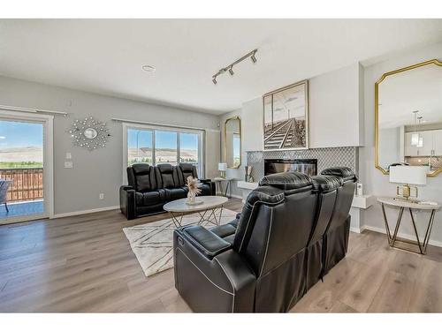 300 Walgrove Boulevard Se, Calgary, AB - Indoor Photo Showing Living Room With Fireplace