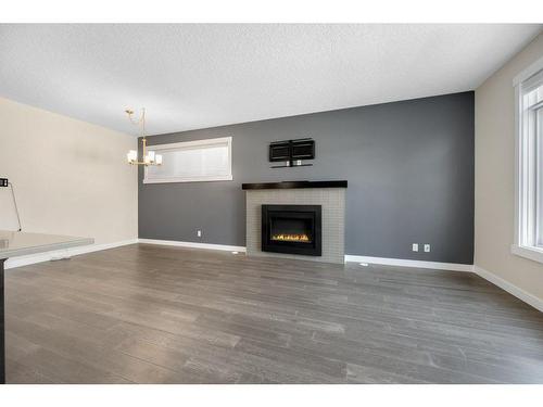 1712 19 Avenue Nw, Calgary, AB - Indoor Photo Showing Living Room With Fireplace