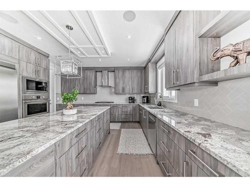 150 Sandpiper Park, Chestermere, AB - Indoor Photo Showing Kitchen With Upgraded Kitchen